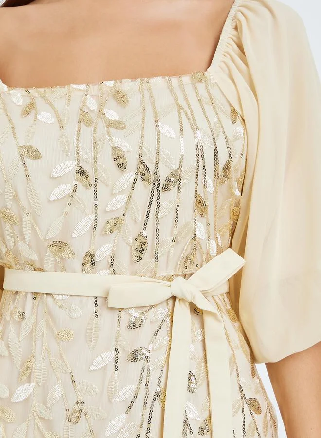 Styli  Women Beige Embroidered Ruffled Hem Maxi Dress for Women | Best Price UAE